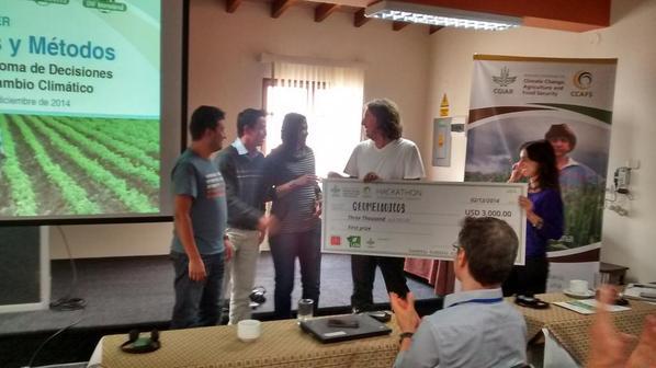 Winners of the Hackathon received their prize from Andy Jarvis and Ana Loboguerrero