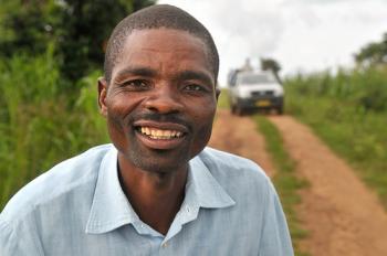 Daimoniz Miondo is one of 800 farmers in Chipeni, Mvera Extension Planning Area, Dowa District, Malawi, who has adopted conservation agriculture practices in recent years. “I’m harvesting between 30 and 40 bags of maize now per acre, where I used to get only 15 or 20 bags,” says Miondo, who farms to support a household of seven. “Before conservation agriculture, there was a lot of erosion and the rain would wash away the fertilizer and affect the yields.” Photo credit: Trevor Samson/CIMMYT